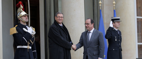 French President Francois Hollande, right, greets Tunisian Prime Minister Habib Essid before a meeting at the Elysee Palace, in Paris, Friday, Jan. 22, 2016. (AP Photo/Christophe Ena)