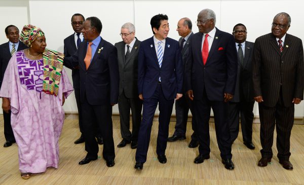 Japanese Prime Minister Shinzo Abe (front C) escorts Sierre Leonean President Ernest Bai Koroma (front 2nd R), Chairperson of the African Union Commission Nkosazana Dlamini-Zuma (front L) and other representatives from African countries prior to the Japan-Africa summit meeting on United Nations Security Council reform during the Tokyo International Conference on African Development (TICAD) in Yokohama, suburban Tokyo, on June 3, 2013. Japan said on June 2 it would give one billion USD in aid to help stabilise the Islamist-infested Sahel region of Africa, months after the deaths of 10 Japanese in a hostage crisis there. AFP PHOTO / Toru YAMANAKA