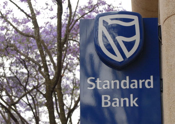 SOUTH AFRICA - OCTOBER 25: The Standard Bank logo is displayed at a branch in Rosebank, Johannesburg, South Africa, on Thursday, Oct. 25, 2007. Industrial & Commercial Bank of China Ltd. will pay 36.7 billion rand ($5.6 billion) for a 20 percent stake in Standard Bank Group Ltd., Africa's largest bank, in the biggest overseas acquisition by a Chinese company. (Photo by Naashon Zalk/Bloomberg via Getty Images)