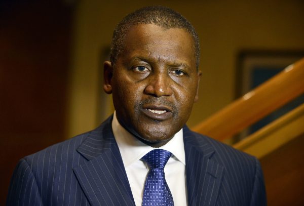 Business magnate man Aliko Dangote, ranked by Forbes Magazine as the richest man in Africa, speaks during a send off ceremony of 250 Nigerian health workers on a mission to fight Ebola virus in affected West African countries and launch of African initiative operating under the hash tag #AfricaAgainstEbola in Lagos on December 3, 2014. Two hundred and fifty volunteer Nigerian medical corps under the auspices of the African Union Support to Ebola Outbreak in West Africa (ASEOWA) were given a send off to fight Ebola Virus Diseases in the affected three West African countries of Liberia, Sierra Leone and Guinea. The African Union, which is collaborating with the private sector to raise funds to support and strengthen the Unions response to the crises, is sending more than 1000 health workers before Christmas. AFP PHOTO/PIUS UTOMI EKPEI (Photo credit should read PIUS UTOMI EKPEI/AFP/Getty Images)